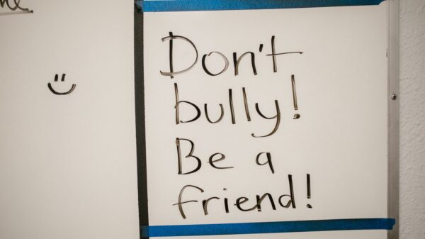 writing that says "don't bully, be a friend."