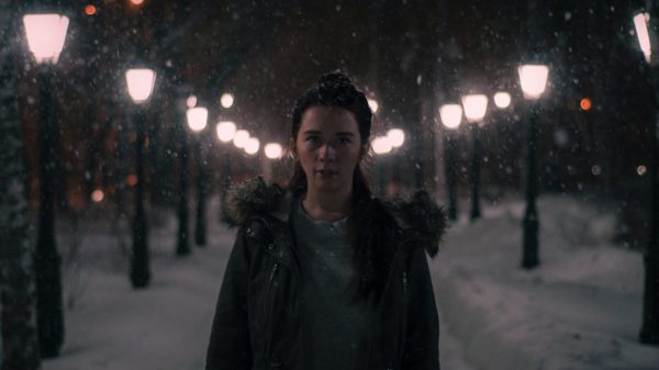 girl in the snow at night.