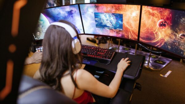 girl playing a video game on her computer.