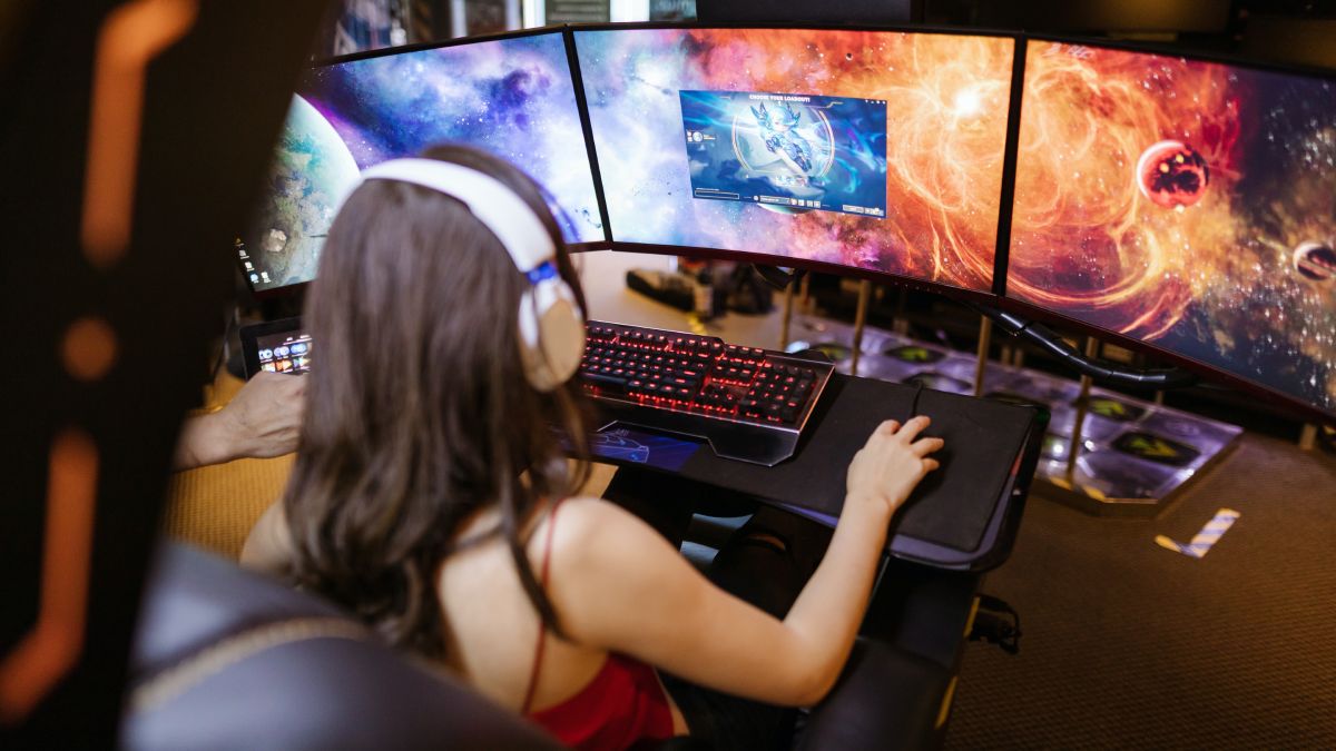 girl playing a video game on her computer.