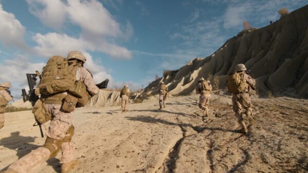 soldiers running in the desert.