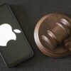apple logo beside a judge's gavel.