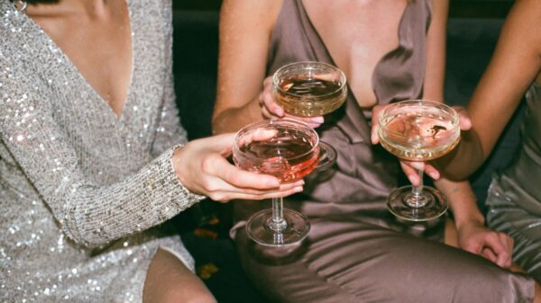 women holding alcoholic drinks.