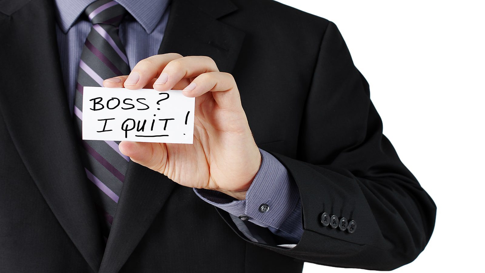 man holding paper that says I Quit.