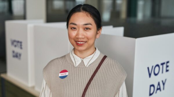 young woman at voting polls.