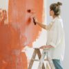 woman painting a room.