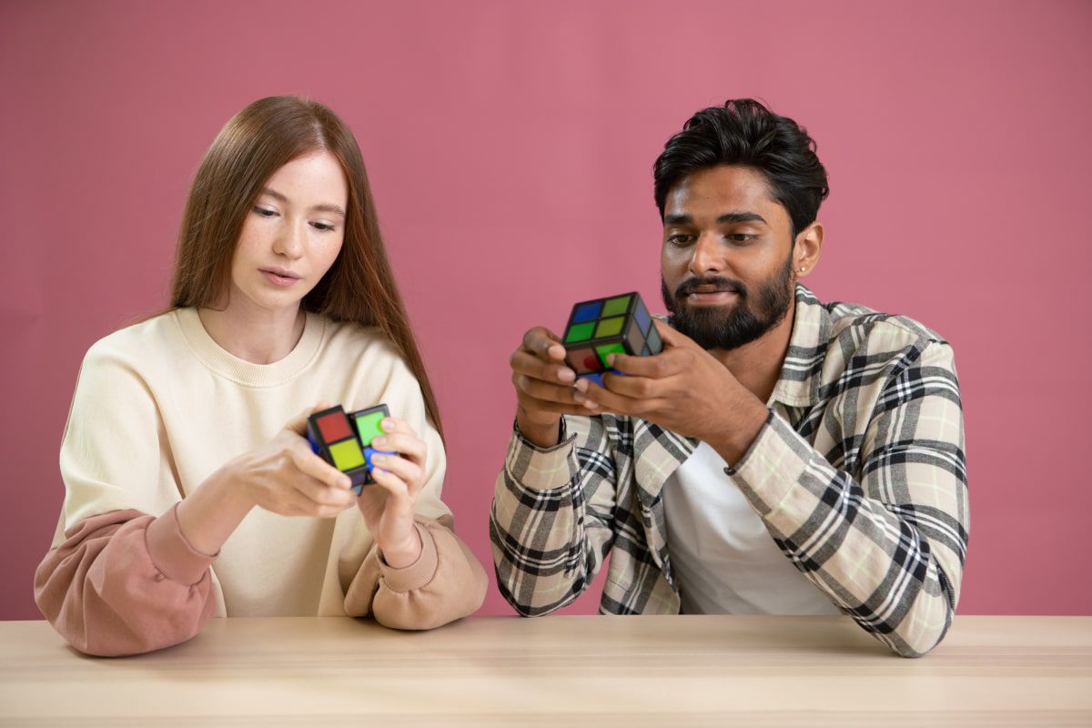 young man and woman playing with the wowcube.