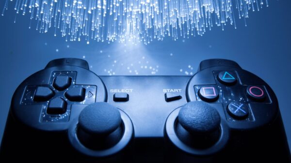 A PlayStation controller under blue light.