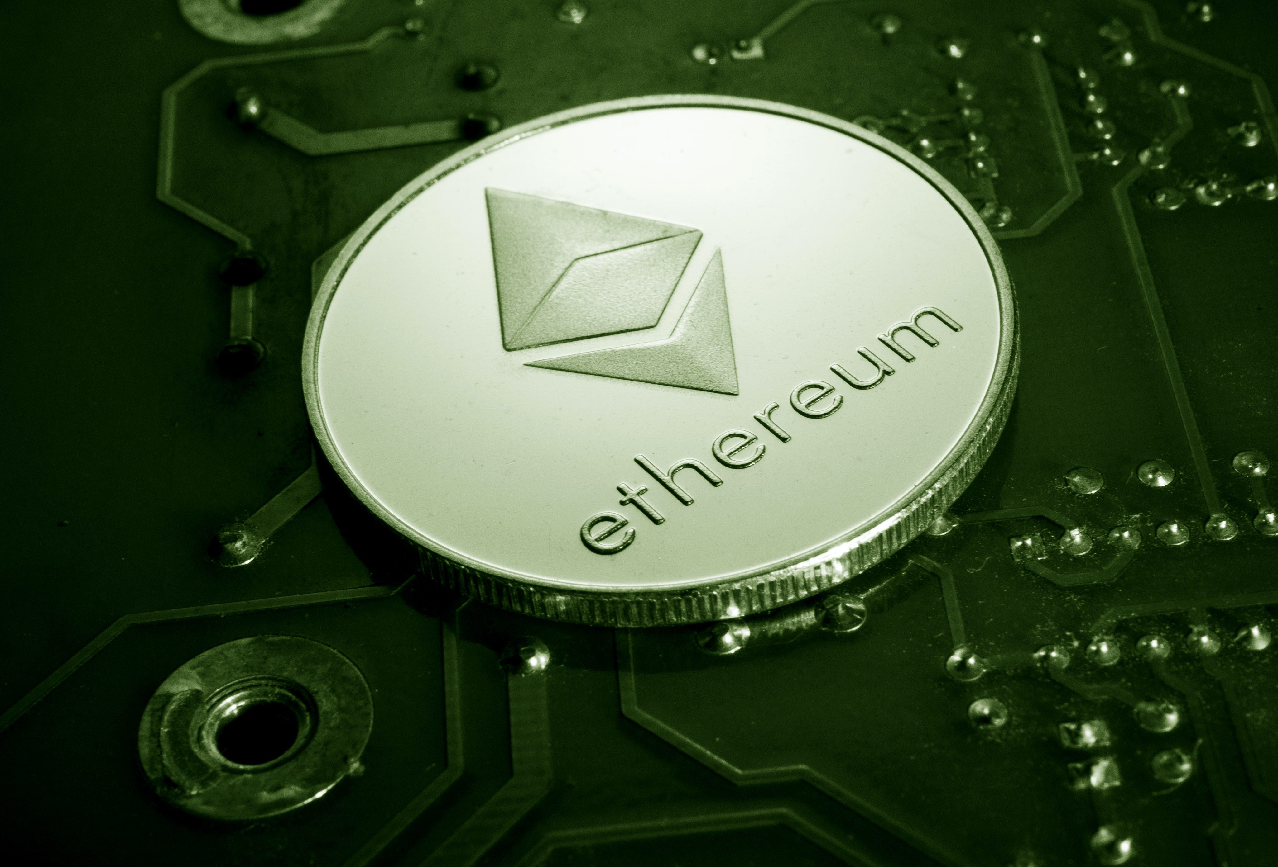 An Ether coin on a motherboard.