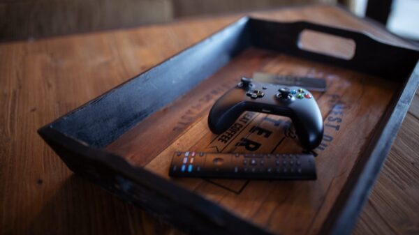 A controller sitting in a tray on a table.