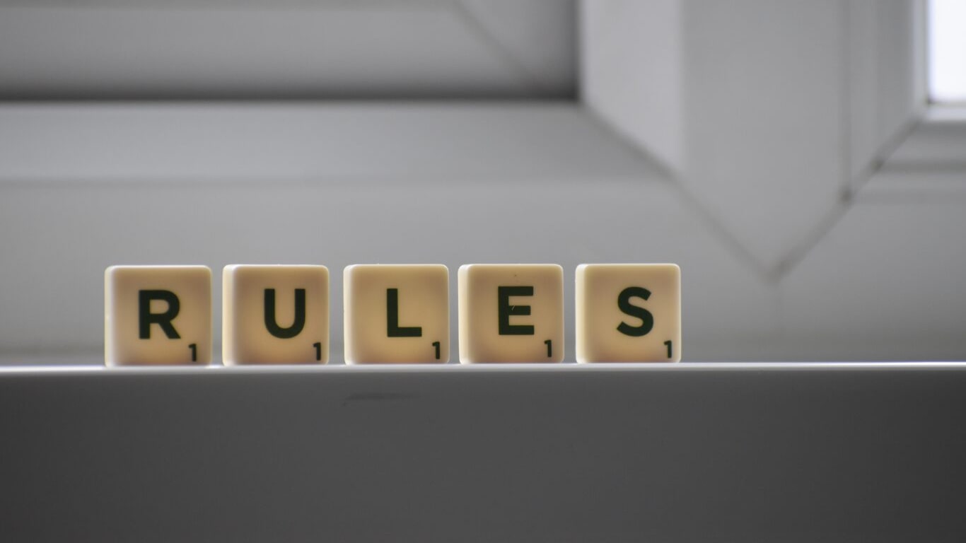"Rules" spelt with scrabble tiles