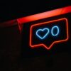 A heart and zero neon sign.