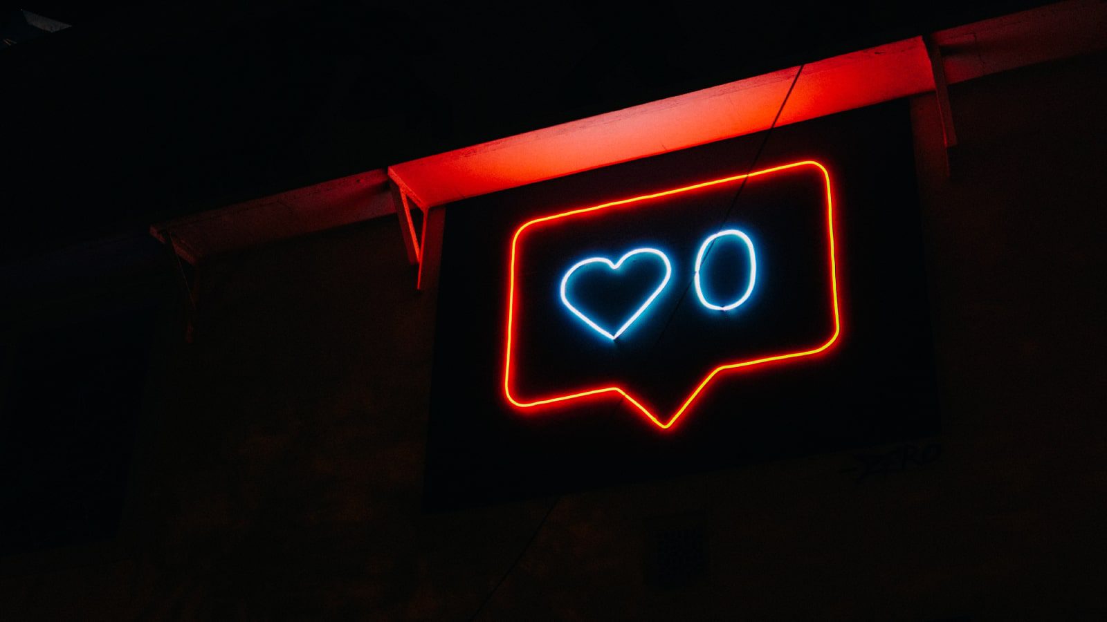 A heart and zero neon sign.