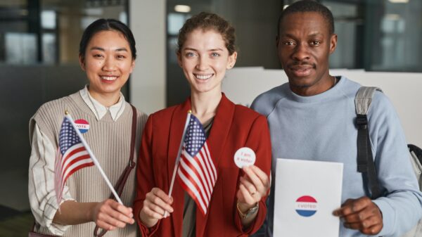 People holding flags and vote stickers