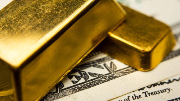 Bars of gold on top of cash.