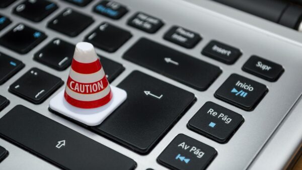 A tiny caution cone on a keyboard.