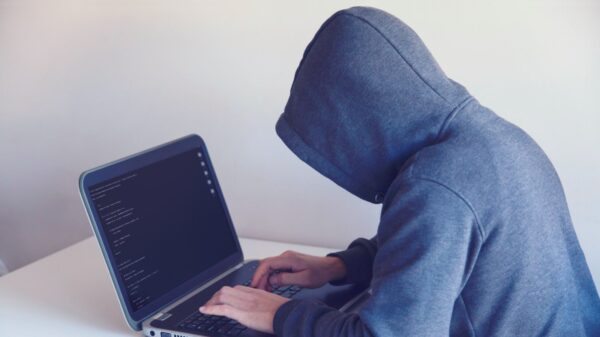 Anonymous person using a laptop.