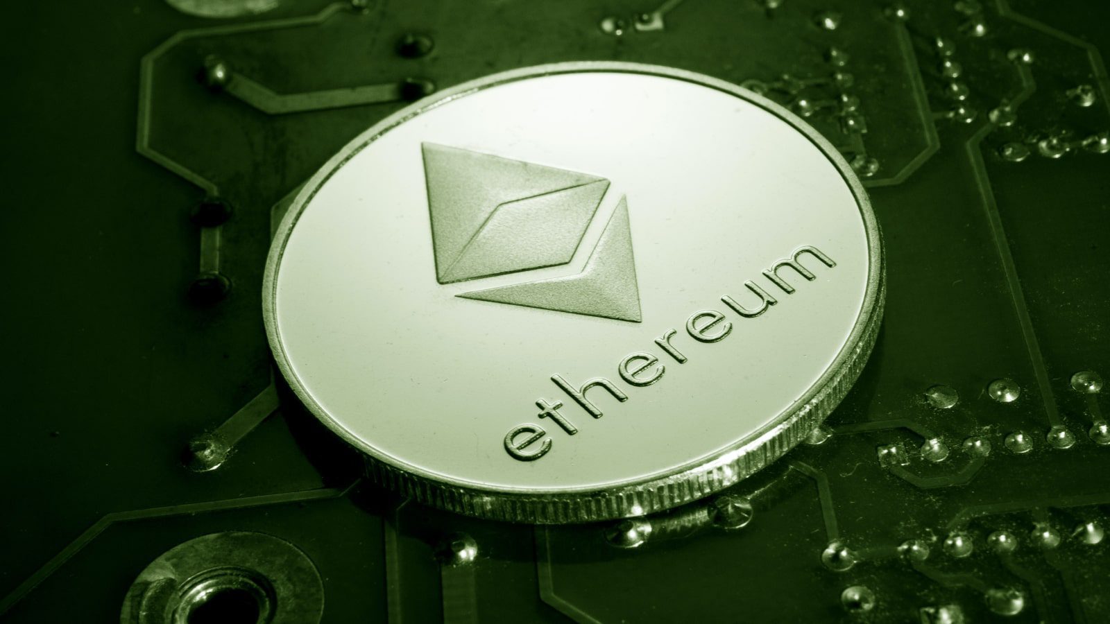 An Ethereum coin on a circuit board.