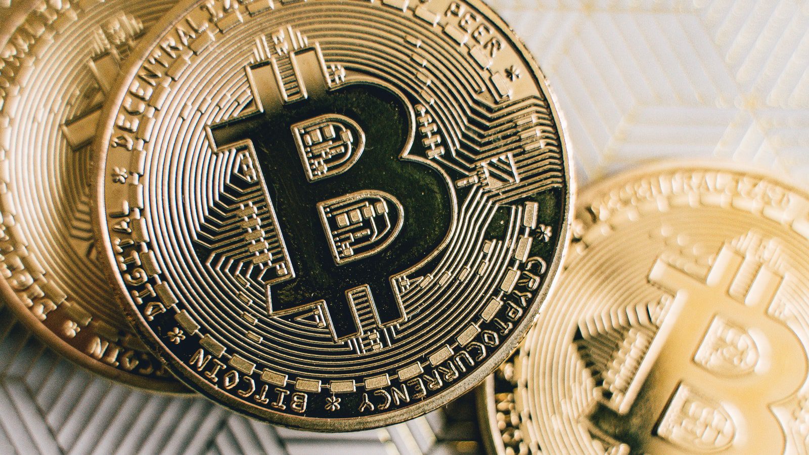 Golden bitcoins on a table.