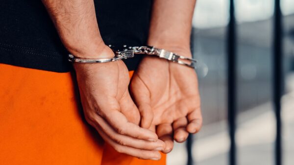 A person in handcuffs.