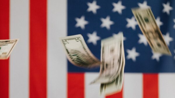 Cash falling in front of an American flag.