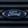 A Ford logo on a car grill.