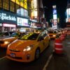 Taxi cabs in Times Square at night.