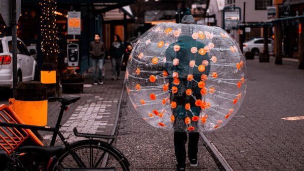 A person wearing a plastic bubble in public.